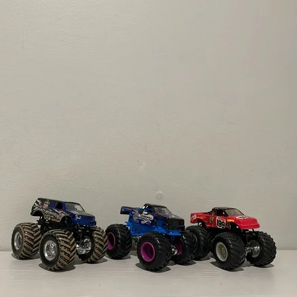 Monster Jam Trucks 1:64 Bounty Hunter, Overall Evolution and HotWheels 199 - Picture 3 of 4